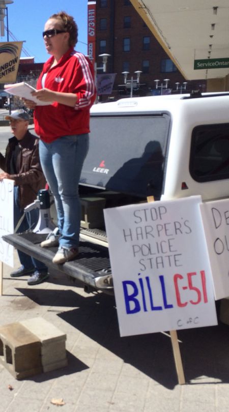 Event organizer Angelle Provencher addressing the anti-Bill C-51 rally in downtown Sudbury today. (Photo by Scott Neigh)