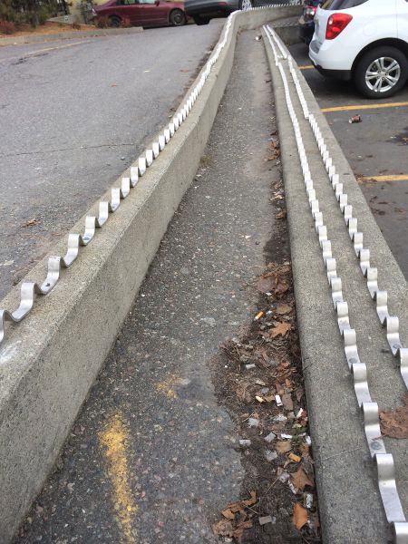 The spikes mentioned by both Aho and Marsh as an element that deliberately shapes the use of public space to the detriment of people living in poverty,  near the bus terminal and the Tim Horton's on Cedar Street in downtown Sudbury. (Photo by Scott Neigh)