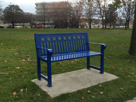 The newer style of bench in Memorial Park in downtown Sudbury, identified by Aho in her research as often used to prevent people from lying down. (Photo by Scott Neigh)