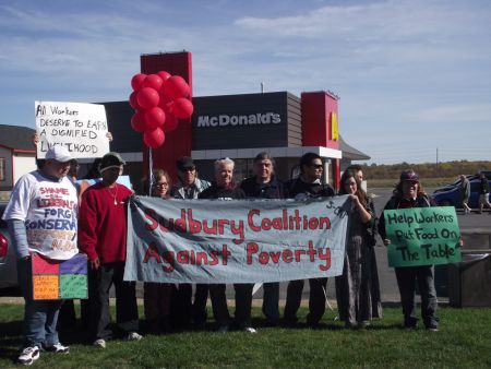 Demonstrators outside McDonald's on Notre Dame Avenue in Sudbury, Ontario, calling for an increase in the minimum wage to $14 an hour.