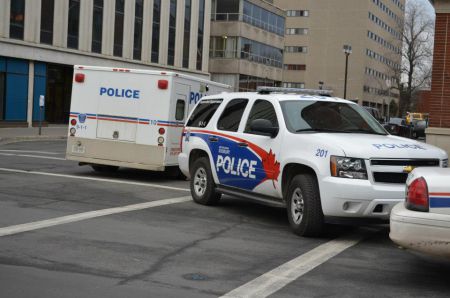 Sudbury police vehicles at an action where eleven anti-poverty activists in Sudbury were arrested in 2012. (Photo from Sudbury Coalition Against Poverty)