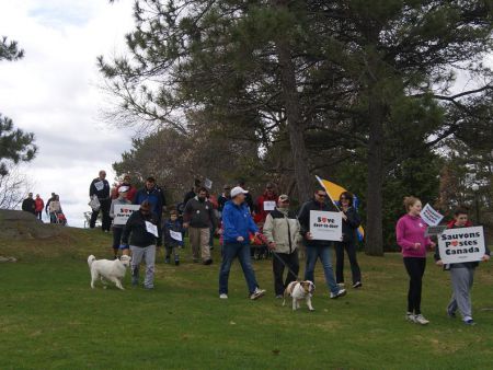 Supporters of Canada post, with their pets and children, make their way out of Bell Park.