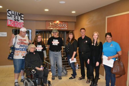 This photo shows members of the board of the Sudbury Workers Education and Advocacy Centre with members of the Sudbury Coalition Against Poverty at an event earlier this fall. (Image provided by SWEAC)