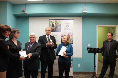 Eat Local Sudbury's Peggy Baillie accepts Trillium plaque.