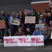 After the assembly/rally inside, people headed to the streets and picked up noise-makers and signs. (Photo by Scott Neigh)