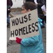 A young demonstrator demanding housing for the homeless. (Photo by Scott Neigh)