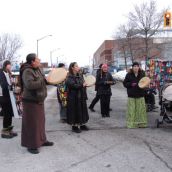 Women drummers and singers perform