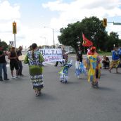 Dancing and drumming at the major downtown intersection of Paris and Brady