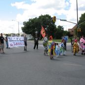 Dancing and drumming at the major downtown intersection of Paris and Brady